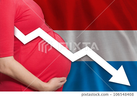 Pregnant woman on flag of Grand Duchy of Luxembourg background. Falling fertility rate Pregnant woman on flag of Grand Duchy of Luxembourg background. Falling fertility rate 106548408