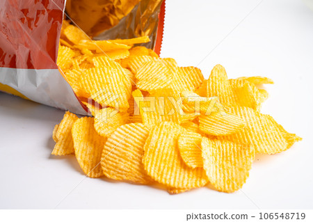 Potato chips, delicious BBQ seasoning spicy for crips, thin slice deep fried snack fast food in open bag. Potato chips, delicious BBQ seasoning spicy for crips, thin slice deep fried snack fast food in open bag. 106548719