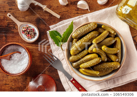 Pickled cucumbers with salt, pepper, and garlic. Fermented food 106549306