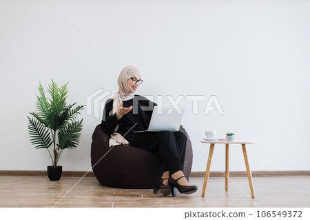 Freelancer taking part in online briefing via laptop indoors Freelancer taking part in online briefing via laptop indoors 106549372