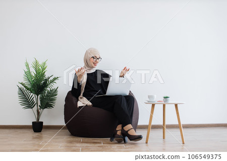Female starting online meeting via computer in workplace Female starting online meeting via computer in workplace 106549375