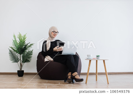 Female starting online meeting via computer in workplace 106549376