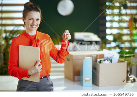 smiling 40 years old woman real estate agent in green office 106549736