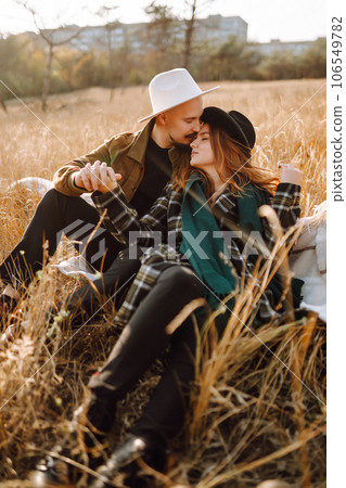 Lovely hipster couple enjoying each other in the autumn park. Nice autumn day. love and lifestyle. 106549782