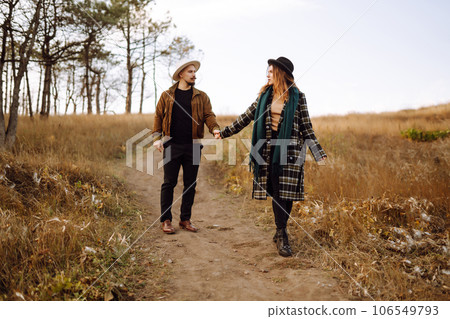 Lovely hipster couple enjoying each other in the autumn park. Nice autumn day. love and lifestyle. 106549793