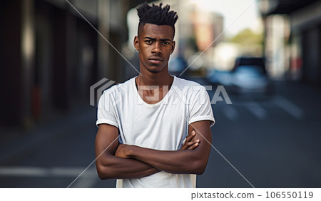 Young serious, self-confident African American male with his arms crossed over his chest. Generative AI 106550119