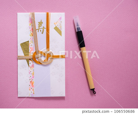 Gift envelope with bright pink background paper and beautiful mizuhiki Gift envelope with bright pink background paper and beautiful mizuhiki 106550686