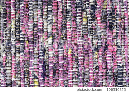 Texture of handmade cotton rug in pink color Texture of handmade cotton rug in pink color 106550853