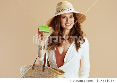 smiling woman in blouse and shorts isolated on beige smiling woman in blouse and shorts isolated on beige 106551037