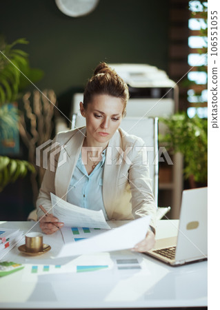 woman worker in light business suit in green office 106551055
