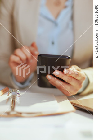 Modern bookkeeper woman in light business suit in green office Modern bookkeeper woman in light business suit in green office 106551090