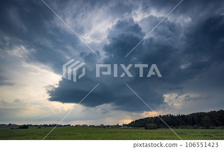 Storm cloud influenced by Climate change. Dangerous storm cloud spinning fast Storm cloud influenced by Climate change. Dangerous storm cloud spinning fast 106551423