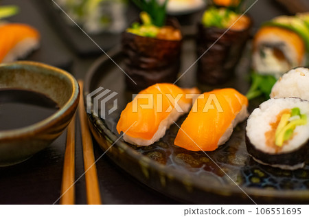 Luxurious and creative Sushi as Nigiri,Futomaki,Uramaki with chopsticks and Soja 106551695
