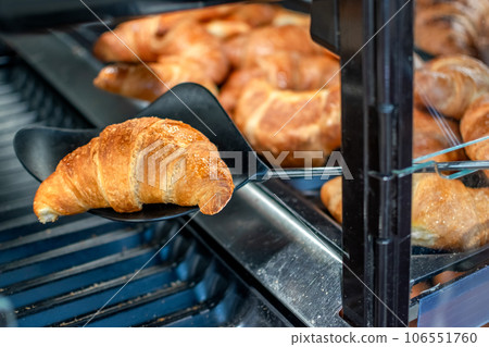 Croissants stored for sale and consumption. Popular French pastries Croissants stored for sale and consumption. Popular French pastries 106551760