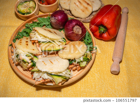 Traditional Arepas originating in Latin America, tasty stuffed corn dough 106551797