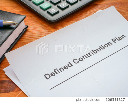 Defined contribution plan papers and a calculator. Defined contribution plan papers and a calculator. 106551827