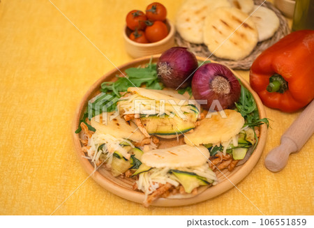 Traditional Arepas originating in Latin America, tasty stuffed corn dough 106551859