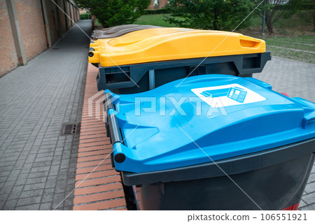 Recycling bins for plastic, cardboard and organic in their colors for public use 106551921