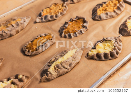 Karelian pasties with mashed potato and carrot filling 106552367