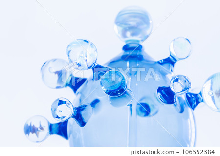 Abstract glass installation over light blue wall 106552384