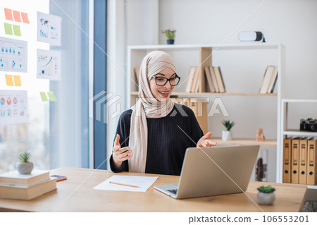Businesswoman getting video call on computer in office 106553201