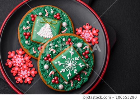 A beautiful Christmas composition consisting of ceramic plates, gingerbread and other elements A beautiful Christmas composition consisting of ceramic plates, gingerbread and other elements 106553290