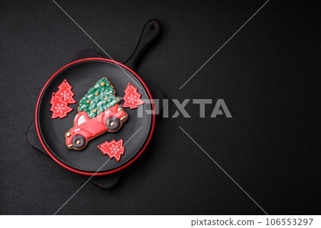 A beautiful Christmas composition consisting of ceramic plates, gingerbread and other elements A beautiful Christmas composition consisting of ceramic plates, gingerbread and other elements 106553297