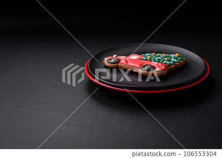 A beautiful Christmas composition consisting of ceramic plates, gingerbread and other elements 106553304
