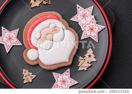 A beautiful Christmas composition consisting of ceramic plates, gingerbread and other elements A beautiful Christmas composition consisting of ceramic plates, gingerbread and other elements 106553320