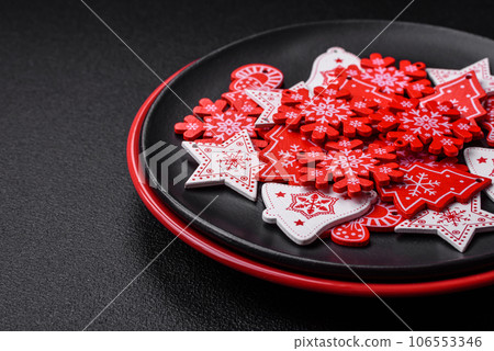 A beautiful Christmas composition consisting of ceramic plates, gingerbread and other elements A beautiful Christmas composition consisting of ceramic plates, gingerbread and other elements 106553346