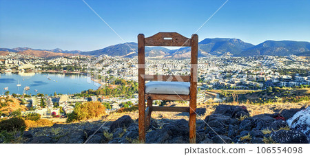 wooden chair standing on the top city on the background wooden chair standing on the top city on the background 106554098