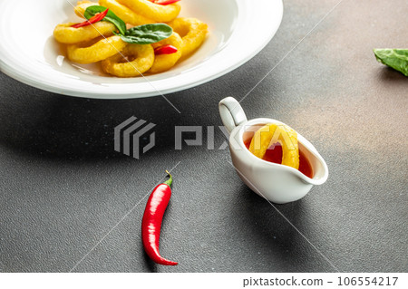 fried squid rings breaded on a dark background. banner, menu, recipe place for text, top view 106554217