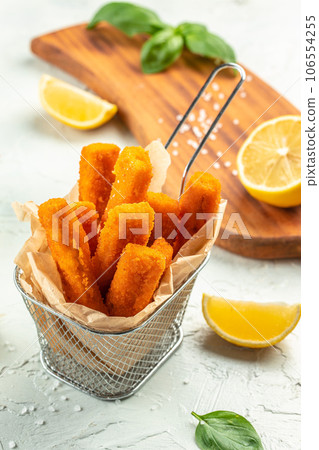 Crispy Fish strips with tartar sauce. Restaurant menu, dieting, cookbook recipe top view 106554255