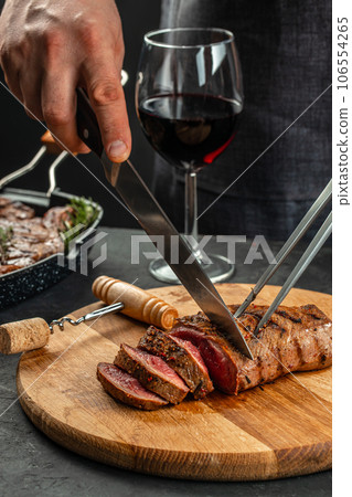 Barbecue steak with green asparagus and red wine. Healthy dinner or lunch. vertical image. top view. place for text 106554265