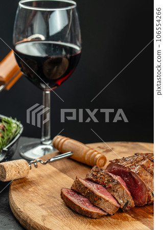 sliced beef grill steak with red wine. The concept of cooking meat 106554266