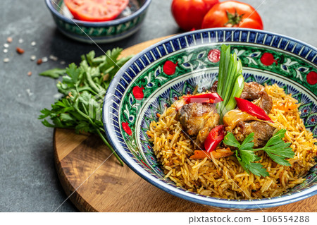 pilaf from from rice, vegetables and meat. Food recipe background. Close up pilaf from from rice, vegetables and meat. Food recipe background. Close up 106554288