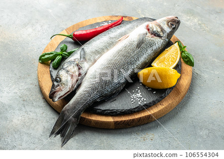 Fresh raw seabass and ingredients for cooking. banner, menu, recipe place for text, top view 106554304