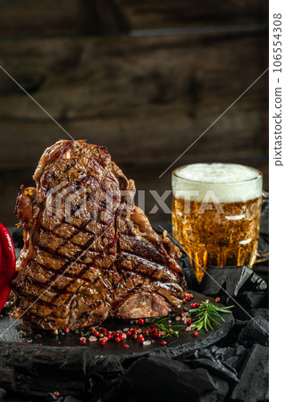 beer steak, Grilled steak and mug of beer. banner, menu, recipe place for text beer steak, Grilled steak and mug of beer. banner, menu, recipe place for text 106554308