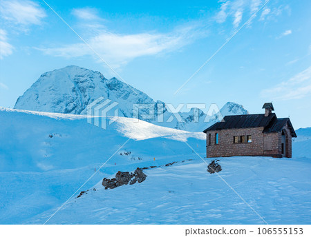 Beautiful winter mountain landscape with chapel on hill top. 106555153