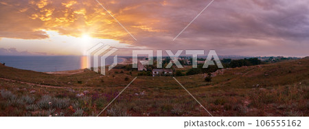 Dramatic sunset sea and evening town on horizon, Crimea, Ukraine. 106555162
