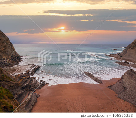 Evening ocean rocky coast. 106555338