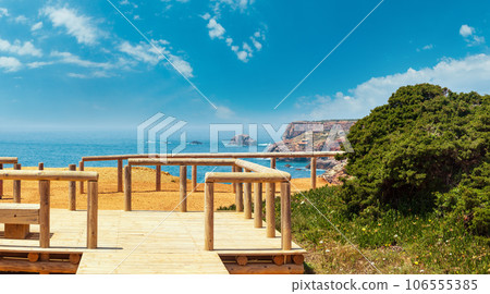 Wooden paths and observation decks on summer Atlantic rocky coast Wooden paths and observation decks on summer Atlantic rocky coast 106555385