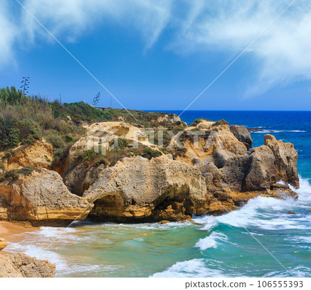 Atlantic rocky coast view (Algarve, Portugal). Atlantic rocky coast view (Algarve, Portugal). 106555393