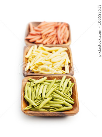 Fusilli pugliesi. Italian tricolor twisted pasta isolated on white background. 106555515