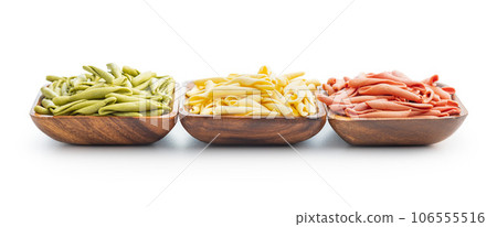 Fusilli pugliesi. Italian tricolor twisted pasta isolated on white background. Fusilli pugliesi. Italian tricolor twisted pasta isolated on white background. 106555516