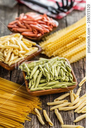 Fusilli pugliesi. Italian tricolor twisted pasta in bowl. Fusilli pugliesi. Italian tricolor twisted pasta in bowl. 106555520