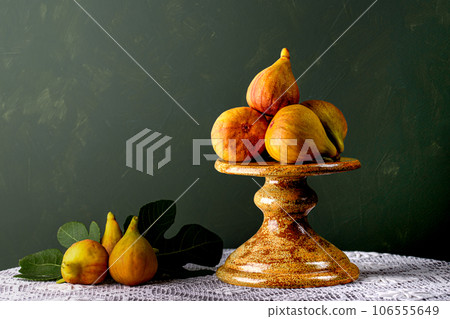 Figs on the cake plate. 106555649
