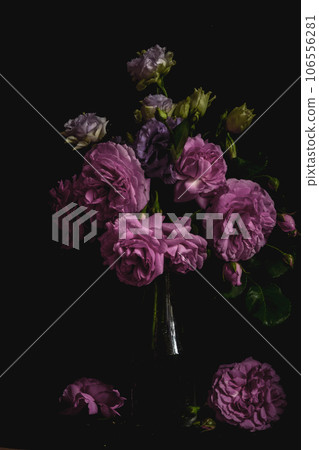 still life. luxury bouquet roses and lisianthus in a glass vase on a 106556281