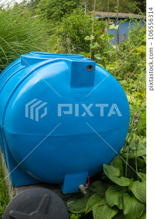 water collection tank under a roof with a drain. Rain water harvesting water collection tank under a roof with a drain. Rain water harvesting 106556314