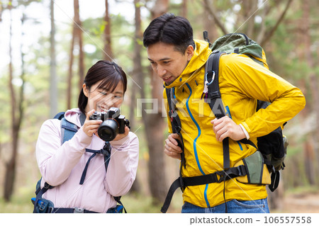 Couple enjoying hiking and photography Couple enjoying hiking and photography 106557558